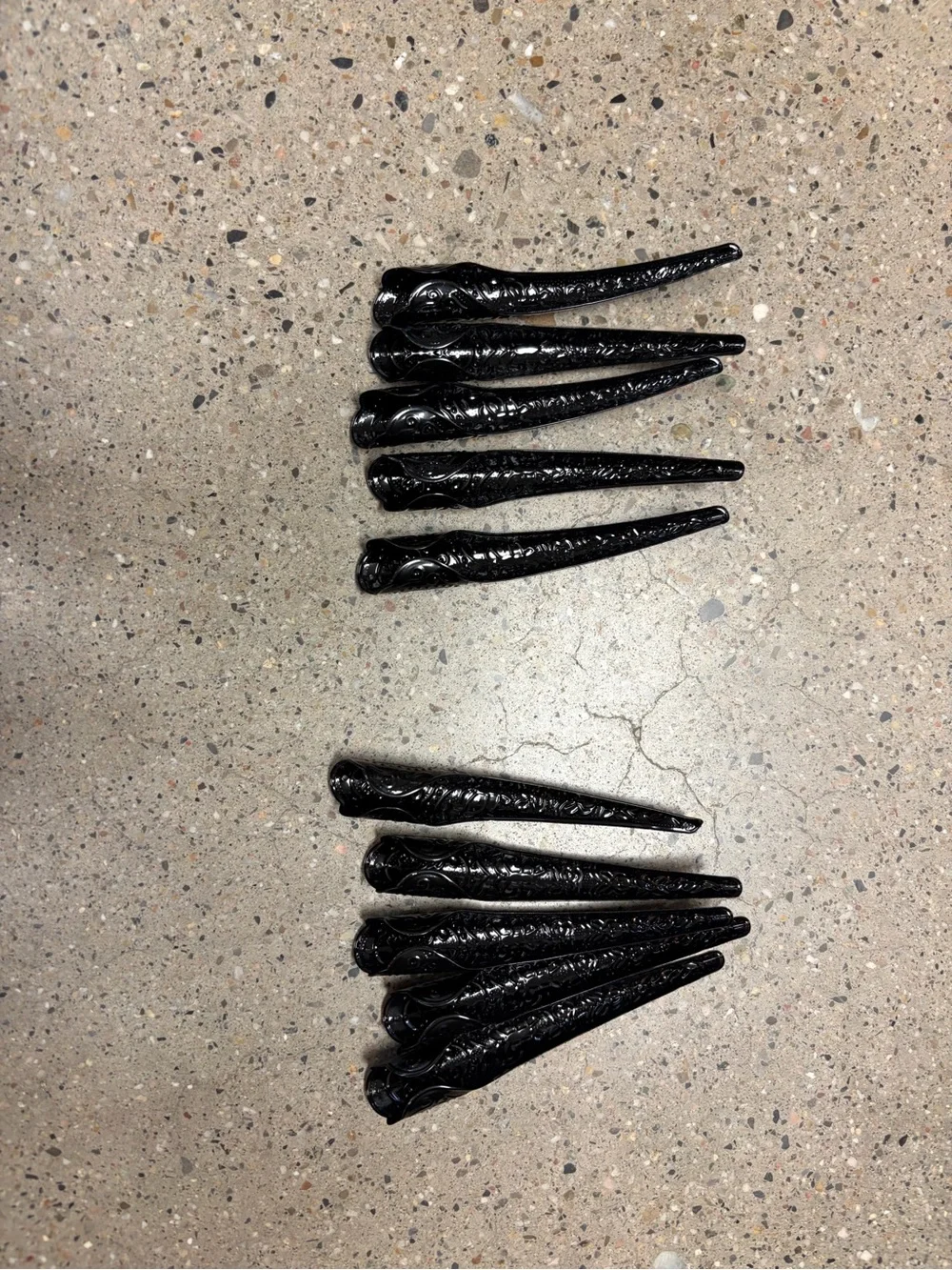 Black women’s gloves with long black finger nails